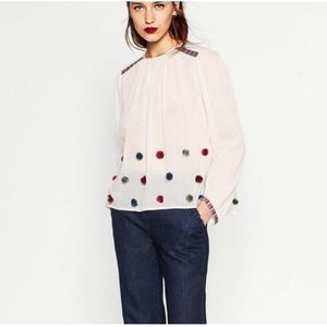 Pom pom blouse with embroidery
